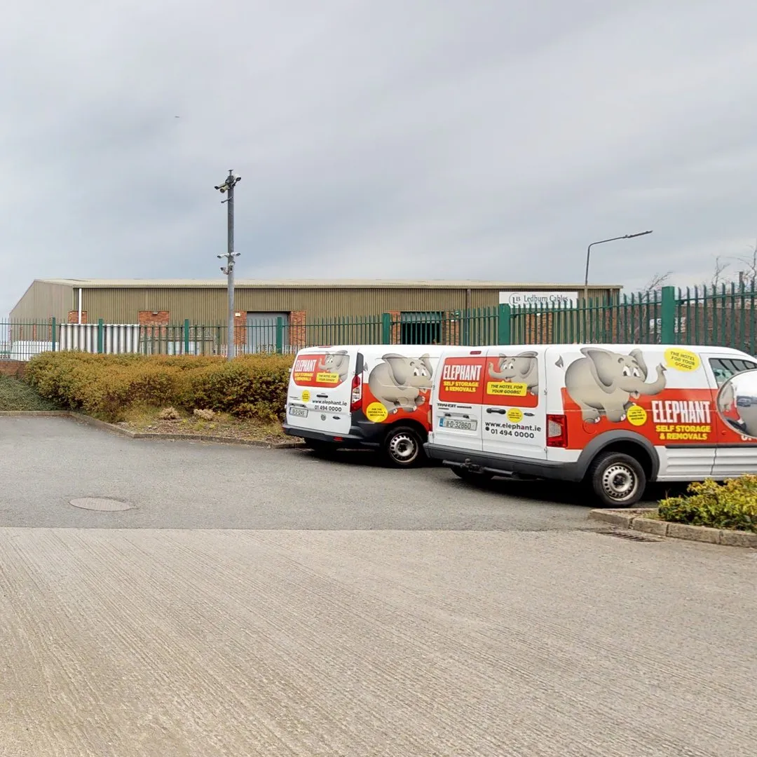 Two vans parked in front of a building at Elephant Click & Store facilities.