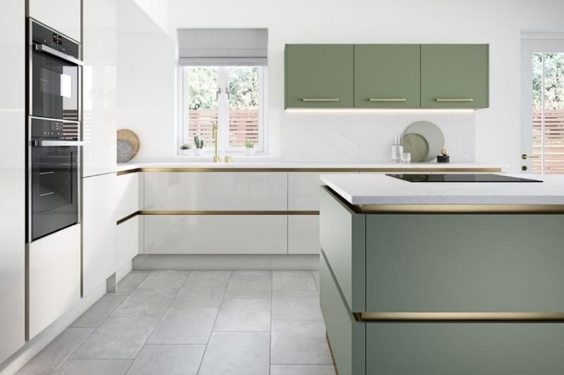 A contemporary kitchen featuring stylish green and gold accents, creating a vibrant and elegant atmosphere.